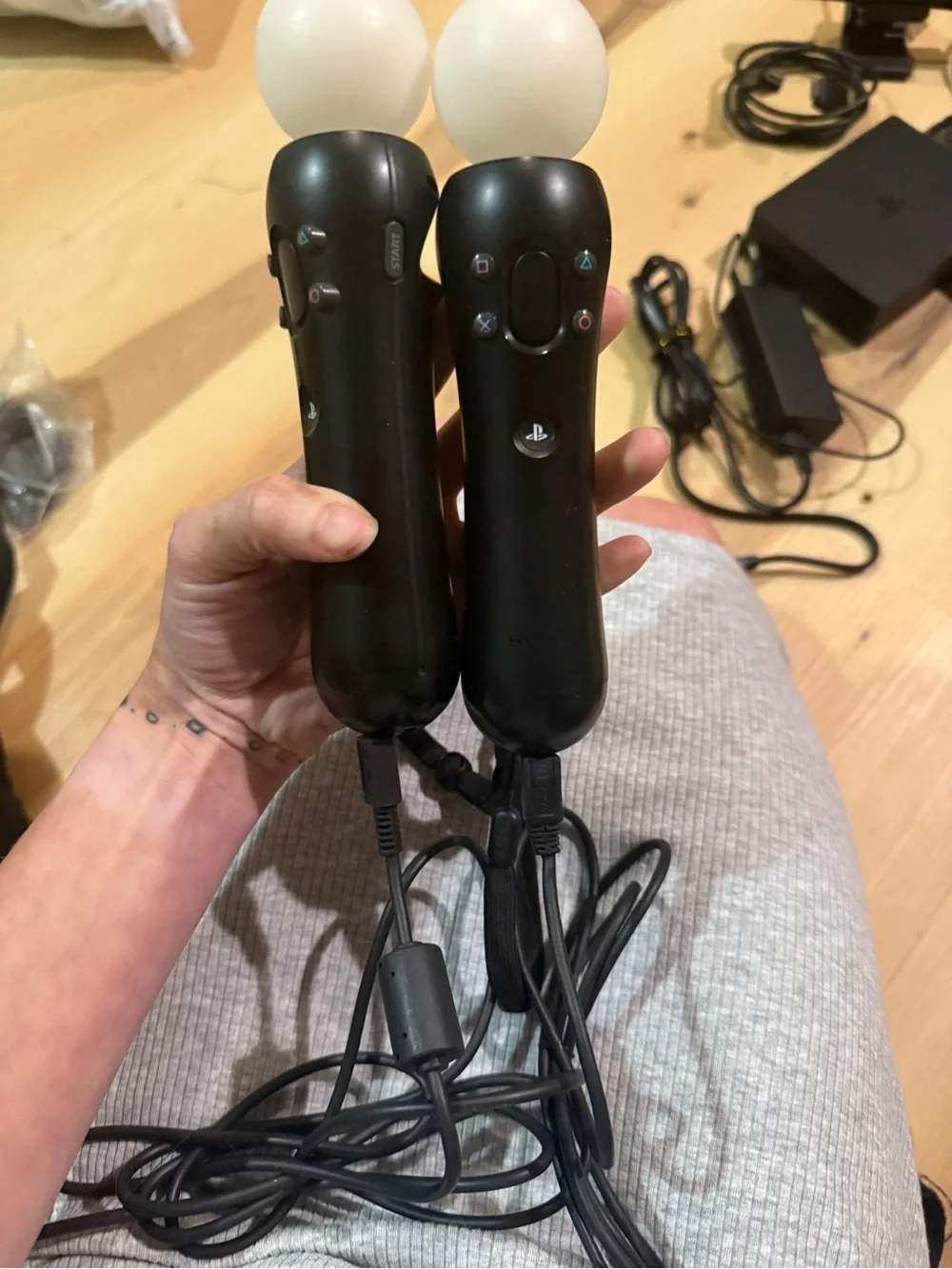 Sony PSVR headset with Black motion controllers and White headset accents